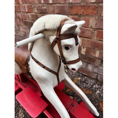 WHITE AND RED PAINTED ROCKING HORSE