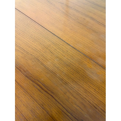 7 - NATHAN TEAK CIRCULAR EXTENDING DINING TABLE WITH FOUR LEATHER UPHOLSTERED CHAIRS