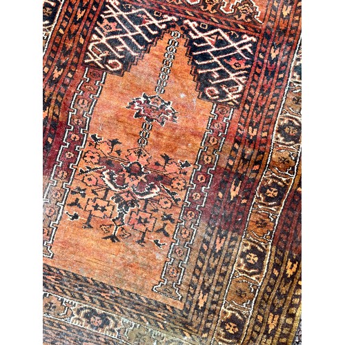 57 - EARLY 20TH CENTURY GEOMETRIC PATTERNED RUSSET GROUND RUG