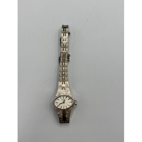 557 - LADIES BOXED BARK TEXTURED ROTARY WRIST WATCH