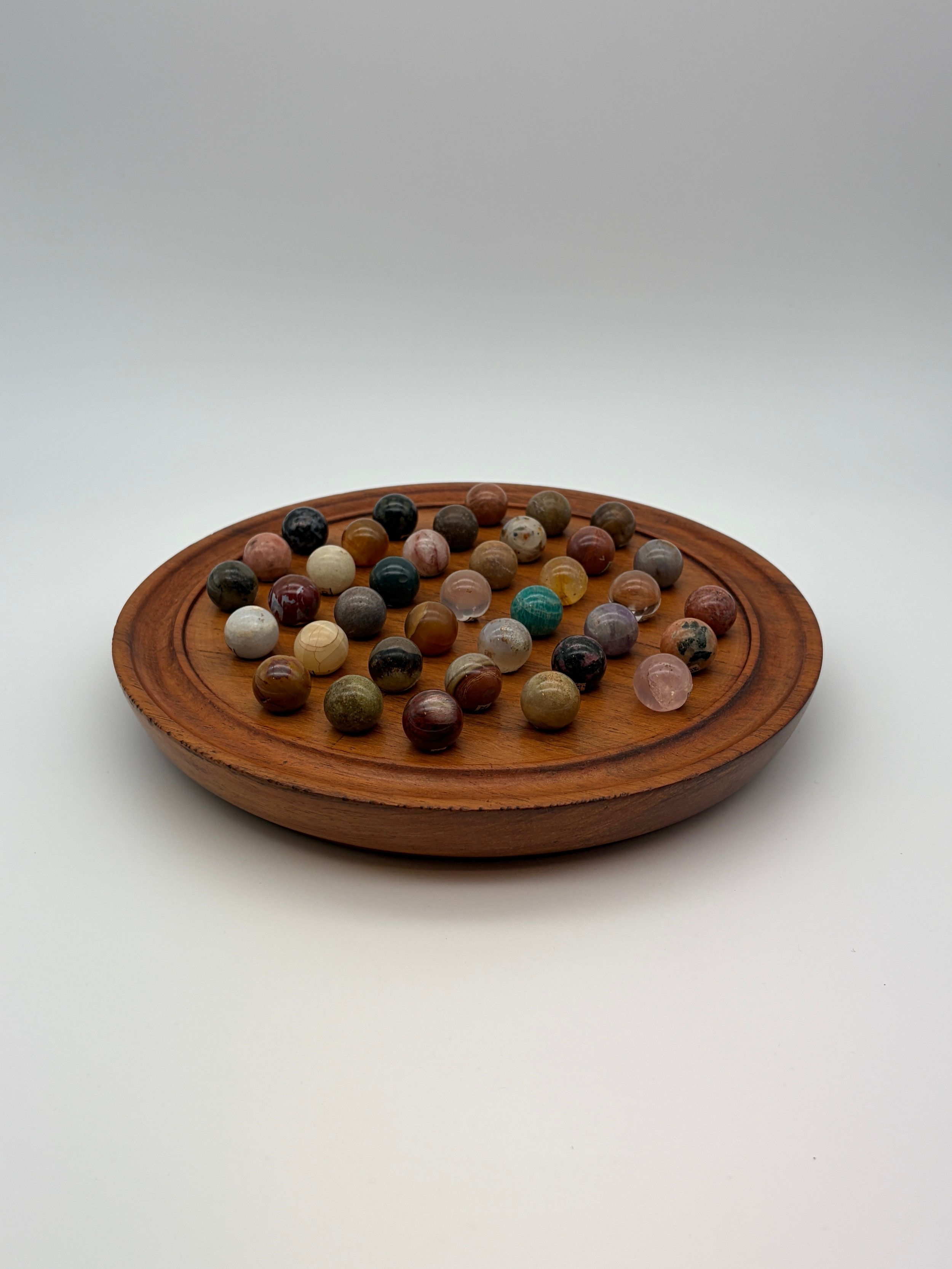 SOLITAIRE BOARD OF POLISHED ROCK SAMPLE MARBLES