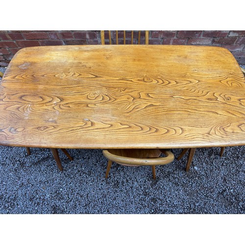 80 - ERCOL ELM WINDSOR DINING TABLE AND FOUR CHAIRS