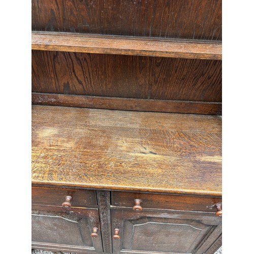 12 - OAK CARVED DRESSER WITH PLATE RACK