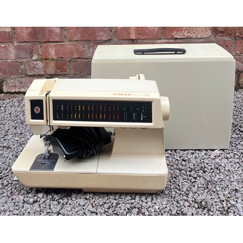 392 - CASED SINGER ELECTRIC SEWING MACHINE