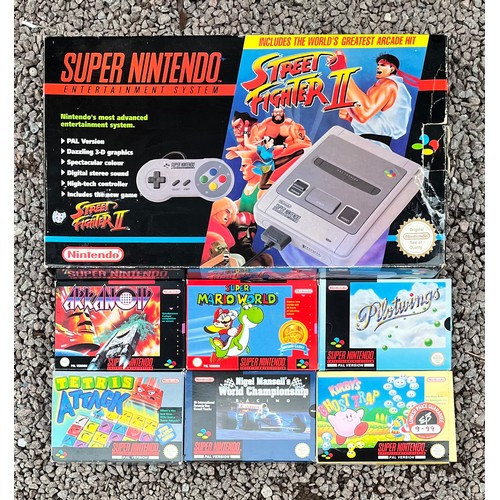 496 - BOXED NINTENDO SUPER NINTENDO ENTERTAINMENT SYSTEM AND SELECTION OF BOXED GAMES INC. MARIO AND KIRBY