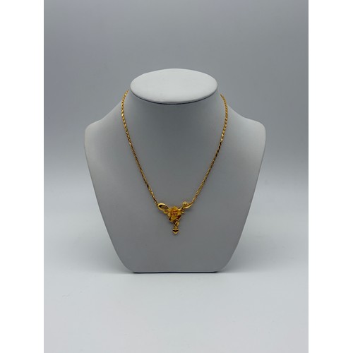 535 - CHINESE YELLOW METAL CHAIN NECKLACE WITH FLORAL HEART DROPPER 14G APPROX.
