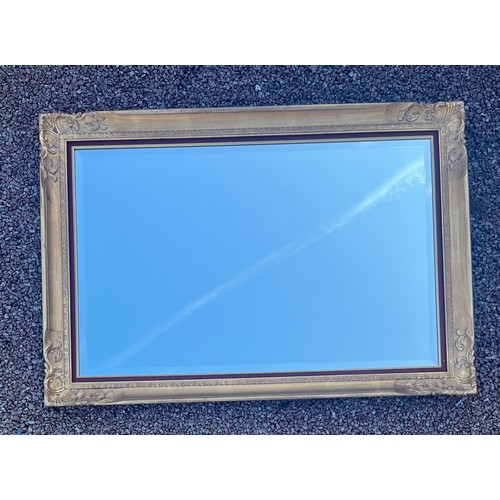 74 - LARGE GILDED SWEPT FRAME BEVELLED OVER MANTLE MIRROR