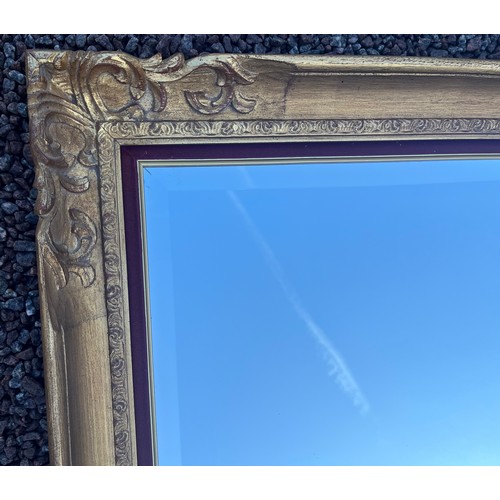 74 - LARGE GILDED SWEPT FRAME BEVELLED OVER MANTLE MIRROR