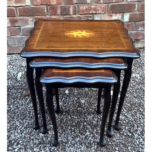 67 - NEST OF THREE MAHOGANY SERPENTINE INLAID SPIDER LEG TABLES