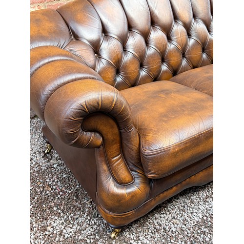 107 - VICTORIAN STYLE BROWN BUTTON BACK LEATHER CHESTERFIELD SOFA AND MATCHING FOOT STOOL