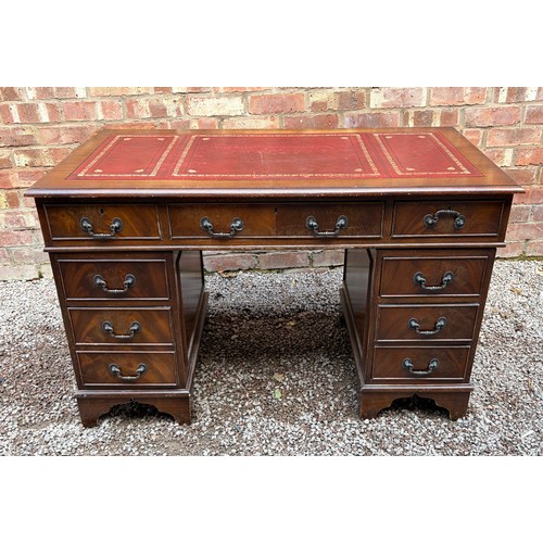 112 - REPRODUCTION GEORGIAN STYLE MAHOGANY NINE DRAWER KNEEHOLE DESK WITH RED LEATHER SCIVER