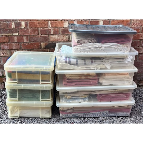 29 - EIGHT CLEAR UPVC BOXES OF LINENS/TOWELS