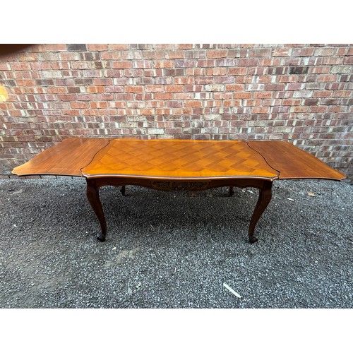 63 - REPRODUCTION NOVE STYLE FRENCH EXTENDING DRAWER LEAF DINING TABLE WITH SIX BERGERE CANED CHAIRS