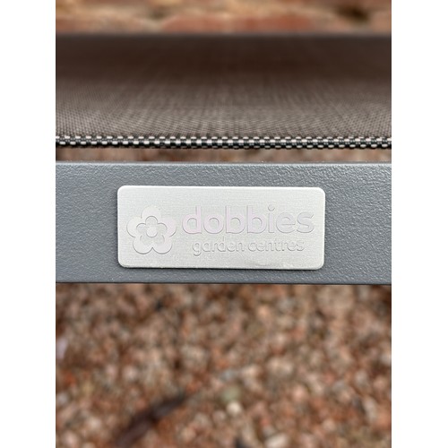 117 - CIRCULAR PATIO TABLE, SIX STACKABLE CHAIRS, PARASOL IN BOX WITH WEIGHTED BASE AND CUSHIONS IN NYLON ... 