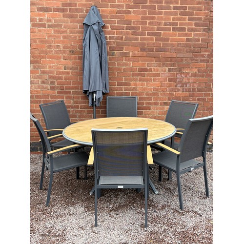 117 - CIRCULAR PATIO TABLE, SIX STACKABLE CHAIRS, PARASOL IN BOX WITH WEIGHTED BASE AND CUSHIONS IN NYLON ... 