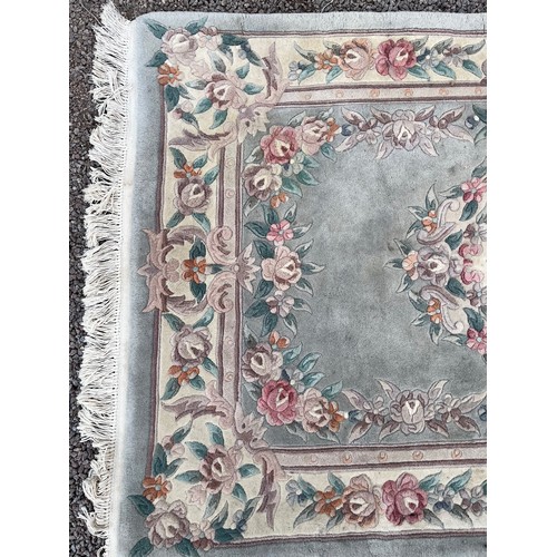 36 - JADE GREEN CHINESE WOOLLEN FRINGED RUG