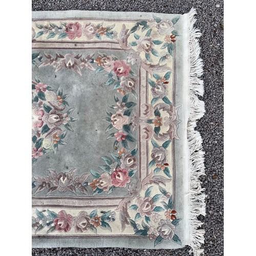 36 - JADE GREEN CHINESE WOOLLEN FRINGED RUG
