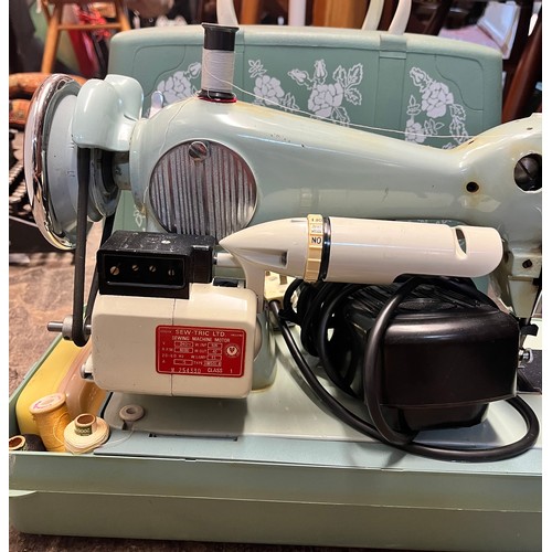 70 - CASED ELECTRIC SEWING MACHINE