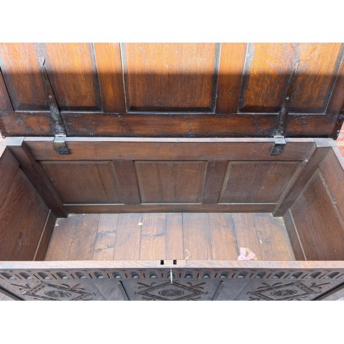 65 - OAK CARVED PANEL FRONT COFFER
