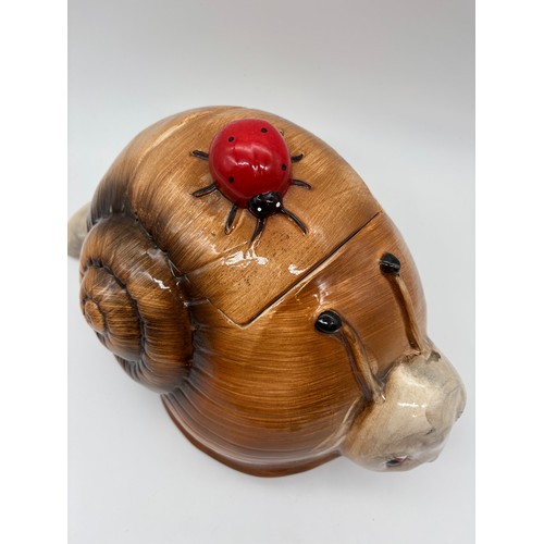 417 - POTTERY SNAIL JAR AND COVER