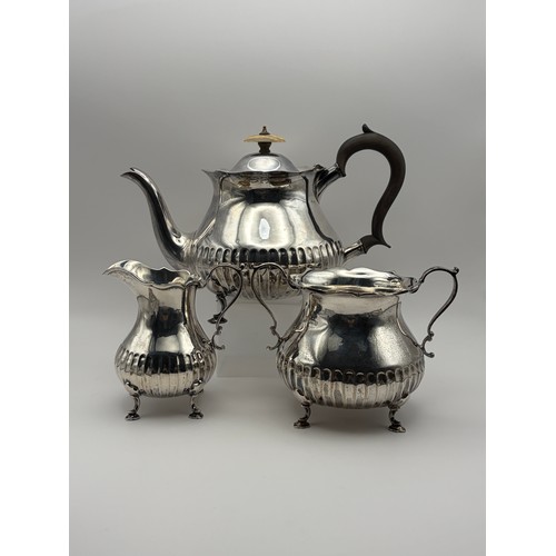 511 - SHEFFIELD SILVER THREE PIECE FLUTTER TEA SERVICE ON RAISED FEET 35 OZ APPROX