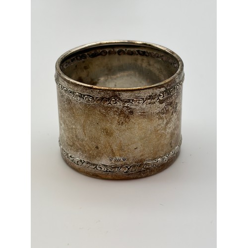 638 - BIRMINGHAM SILVER OVAL-SHAPED NAPKIN RING AND 800 WHITE METAL NAPKIN RING