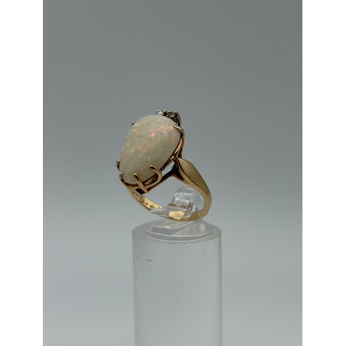 601 - 14CT GOLD CLAW SET OPAL AND DIAMOND RING 4.8G APPROX