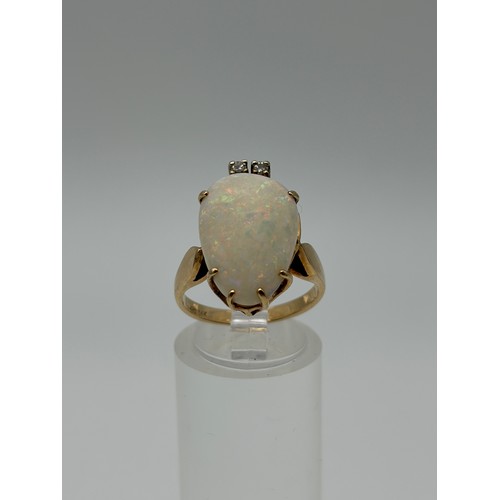 601 - 14CT GOLD CLAW SET OPAL AND DIAMOND RING 4.8G APPROX