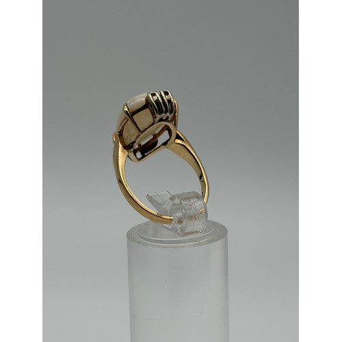 601 - 14CT GOLD CLAW SET OPAL AND DIAMOND RING 4.8G APPROX