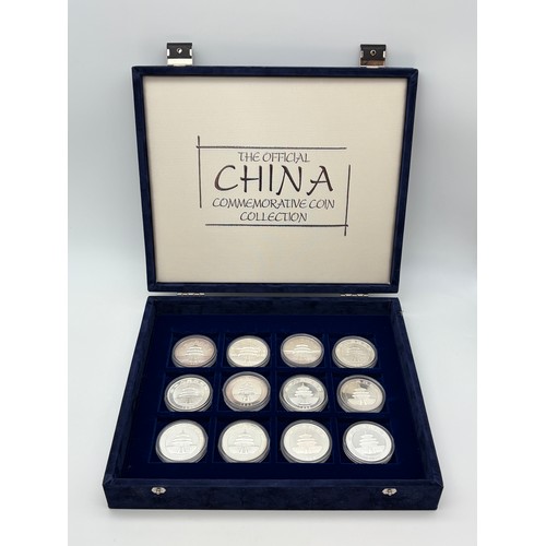 570 - THE OFFICIAL CHINA COMMEMORATIVE COIN COLLECTION 1989-2000 1 OZ SILVER 10 YUAN