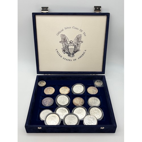 569 - SILVER COINS OF THE UNITED STATES OF AMERICA MADE UP OF 15 SILVER 1OZ DOLLARS AND HALF DOLLAR