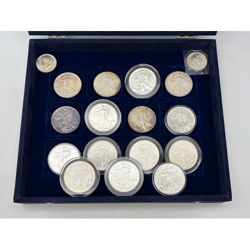 569 - SILVER COINS OF THE UNITED STATES OF AMERICA MADE UP OF 15 SILVER 1OZ DOLLARS AND HALF DOLLAR