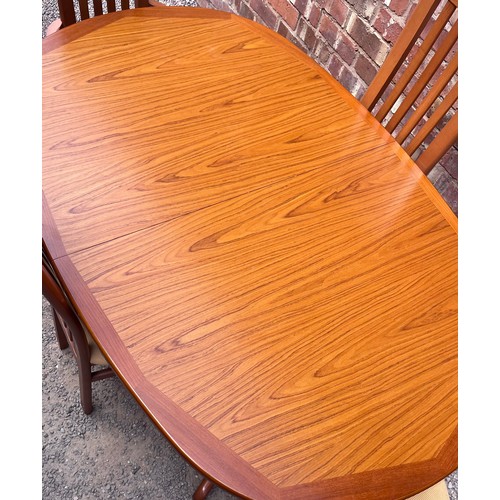 41 - G PLAN OVAL EXTENDING DINING TABLE AND FOUR CHAIRS