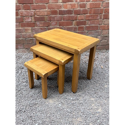 44 - NEST OF THREE LIGHT OAK TABLES