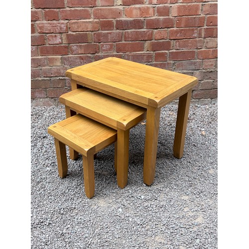 44 - NEST OF THREE LIGHT OAK TABLES