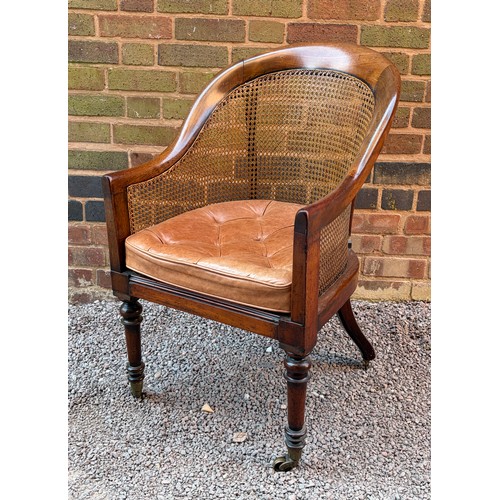74 - 19TH CENTURY MAHOGANY TUB READING ARM CHAIR WITH BERGERE CANED BACK AND LEATHER BUTTONED SEAT