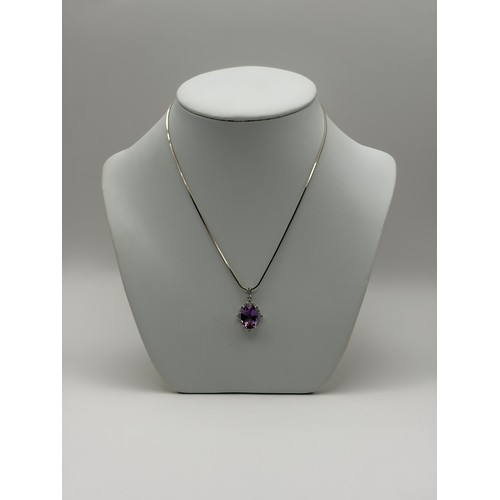 554 - SILVER OVAL AMETHYST AND CZ PENDANT ON SILVER HERRINGBONE CHAIN