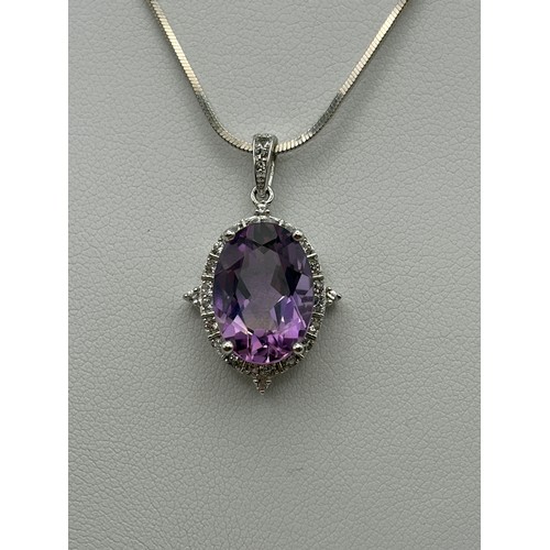 554 - SILVER OVAL AMETHYST AND CZ PENDANT ON SILVER HERRINGBONE CHAIN