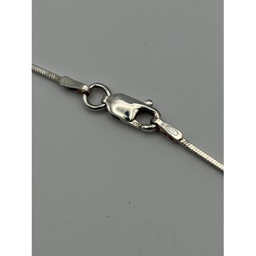 554 - SILVER OVAL AMETHYST AND CZ PENDANT ON SILVER HERRINGBONE CHAIN