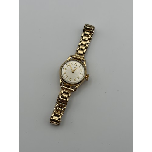 556 - LADIES TISSOT 9CT GOLD WATCH ON 9CT GOLD BRACELET STRAP 20G OVERALL