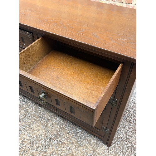 15 - TUDOR STYLE OAK THREE PANEL SIDEBOARD