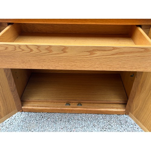 29 - LIGHT OAK SHELVING UNIT WITH TWO DOOR BASE