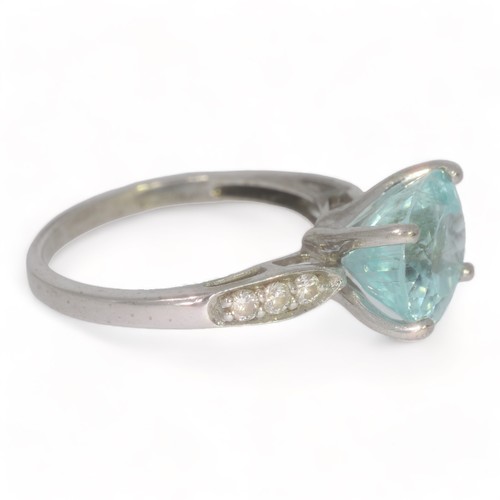 53 - A 18ct white gold blue / green Cuprian Tourmaline & Diamond Dress ring.
The tourmaline measures appr... 