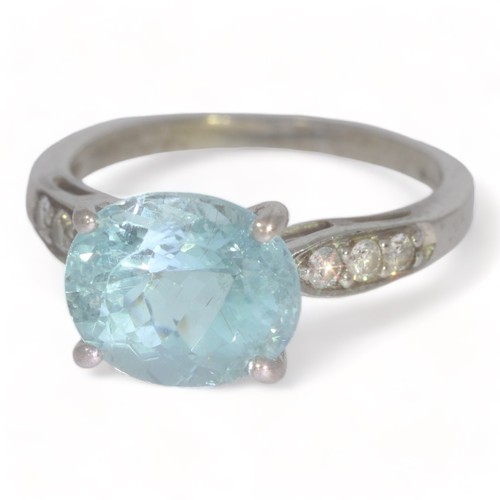 53 - A 18ct white gold blue / green Cuprian Tourmaline & Diamond Dress ring.
The tourmaline measures appr... 