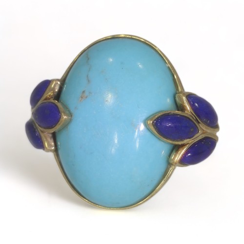 54 - A 9ct yellow gold turquoise and lapis lazuli dress ring.
The oval cabochon cut turquoise measures ap... 