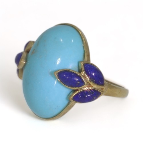 54 - A 9ct yellow gold turquoise and lapis lazuli dress ring.
The oval cabochon cut turquoise measures ap... 