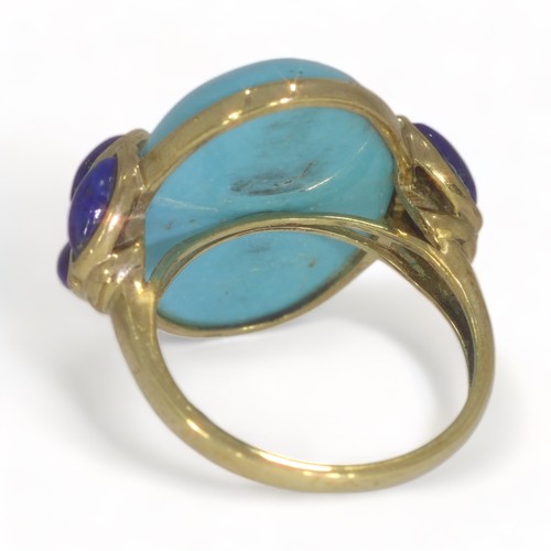 54 - A 9ct yellow gold turquoise and lapis lazuli dress ring.
The oval cabochon cut turquoise measures ap... 