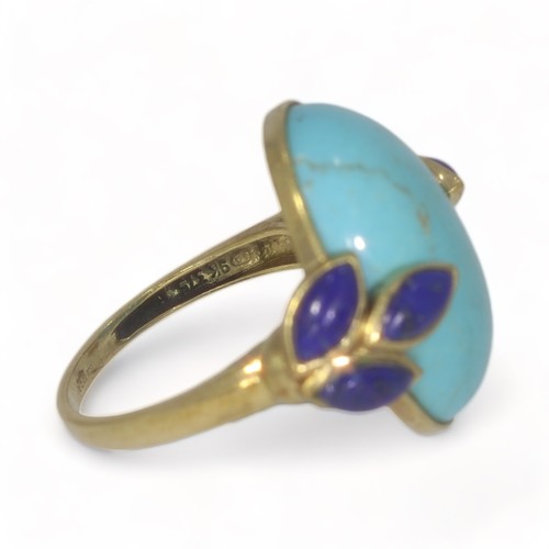 54 - A 9ct yellow gold turquoise and lapis lazuli dress ring.
The oval cabochon cut turquoise measures ap... 