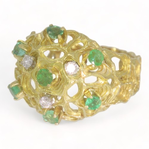 56 - A 18ct yellow gold diamond and emerald abstract dress ring.
Three round brilliant cut diamonds total... 