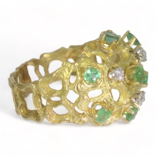 56 - A 18ct yellow gold diamond and emerald abstract dress ring.
Three round brilliant cut diamonds total... 